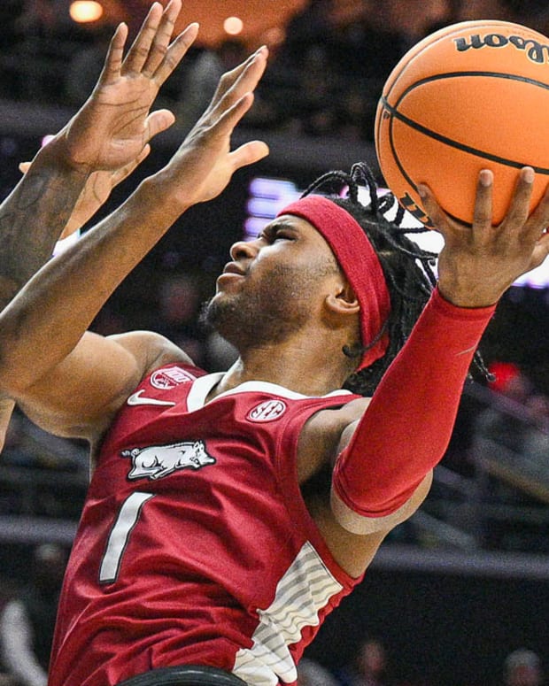 Razorbacks Ricky Council IV puts up a shot inside against Kansas on Saturday at NCAA Tournament.